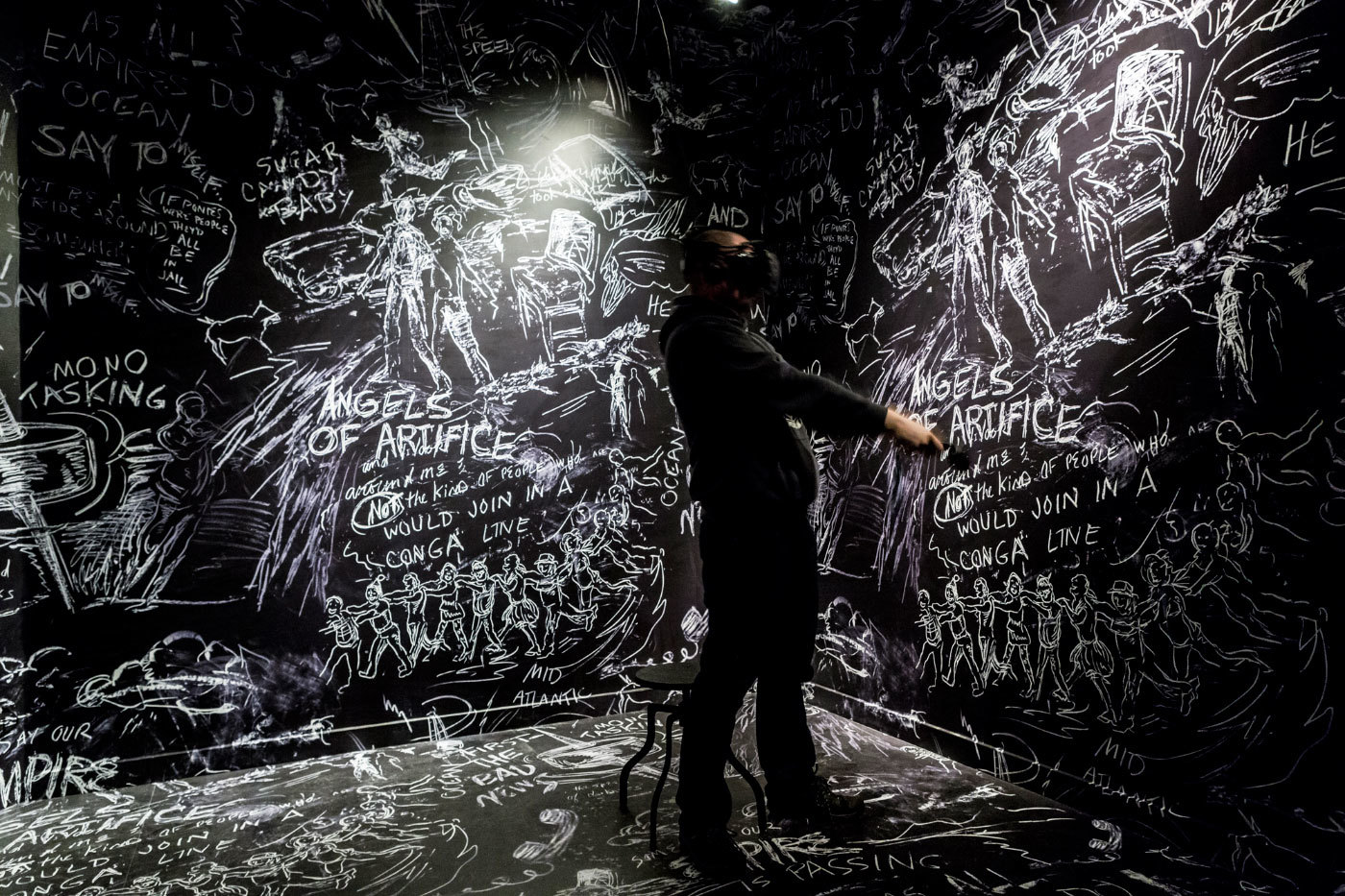 Visitor experiencing Chalkroom, by Laurie Andersoon and Hsin-Chien Huang